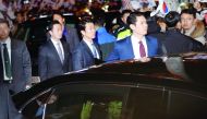 South Korea's ousted leader Park Geun-hye sitting inside a car waves to her supporters upon her arrival to her private house in Seoul, yesterday.