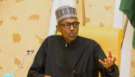 Nigerian President Mohammadu Buhari addresses members of his cabinet upon his arrival at the presidency in Abuja, on March 10, 2017.  AFP / Sunday AGHAEZE
