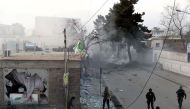 Afghan security personnel arrive at the site of an explosion in Kabul on March 13, 2017.   AFP / WAKIL KOHSAR
