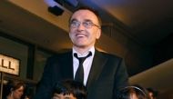Director Danny Boyle poses with ''Slumdog Millionaire'' actors Azharuddin Mohammed Ismail (L) and Rubina Ali at the Governors Ball during the 81st Academy Awards in Hollywood, California February 22, 2009. REUTERS/Lucas Jackson