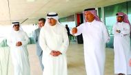 Dr Mohammed Abdulatif Al Fares, the Minister of Education and Higher Education of Kuwait, with Eng. Saad Ebrahim Al Muhannadi, lifetime member of the Board of Directors, QF, viewing the education and research buildings of Education City from the open-air 