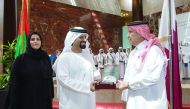 Saleh Mohammed Bin Nasra, UAE’s Ambassador to Qatar receives a memento from Saad al Muhannadi at HBKU, at a programme held to mark Emirati Culture Day.