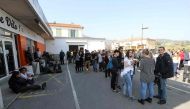 People gather near the Tocqueville high school in the southern French town of Grasse, on March 16, 2017 following a shooting that left eight people injured. AFP / Valery HACHE
