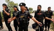 Security personnel block the road where police shot dead a suspected militant who tried to enter a security checkpost on a motorcycle armed with explosives in Khilgaon, outskirt of Dhaka, Bangladesh, March 18, 2017. REUTERS/Mohammad Ponir Hossain.