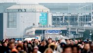 (FILES) This file photo taken on March 22, 2016 shows passengers evacuating the Brussels Airport, in Zaventem, after a string of explosions rocked Brussels airport and a city metro station. Belgium will mark on March 22, 2017, the first anniversary of dea