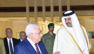 Emir H H Sheikh Tamim bin Hamad Al Thani with President of the State of Palestine, Mahmoud Abbas, at the Emiri Diwan, yesterday.