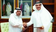 H E Mohamed bin Abdullah Al Rumaihi (right), Minister of Municipality and Environment and Sheikh Faisal bin Qassim Al Thani, Chairman of the Board of Trustees of Al Faisal Without Borders Foundation, at the MoU signing event. 