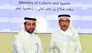 H E Salah bin Ghanem Al Ali (right), Minister of Culture and Sports, being honoured as CSR Person of the Year 2016 by QU President Dr Hassan Al Derham.