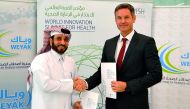Mohammed Albinali, Executive Director, Weyak, and Egbert Schillings, Chief Executive Officer, WISH, after signing a Memorandum of Understating (MoU) to establish a cooperative framework to promote mental health in Qatar.