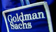 The logo of Goldman Sachs is seen on the clothing of a trader working at the Goldman Sachs stall on the floor of the New York Stock Exchange.