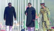 Pakistan's Prime Minister Nawaz Sharif (centre) guides President Mamnoon Hussain during a Pakistan Day military parade, in Islamabad, yesterday. 