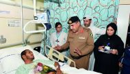GCC traffic delegation visits an injured patient at Hamad General Hospital. 