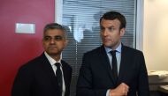 French presidential election candidate for the En Marche ! movement Emmanuel Macron (R) meets with the mayor of London Sadiq Khan on March 29, 2017 at his campaign headquarters in Paris. / AFP / Eric FEFERBERG
