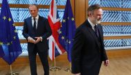 Britain's Ambassador to the EU Tim Barrow (R) walks away after handing European Council President Donald Tusk the British prime minister's formal notice of the UK's intention to leave the EU under Article 50 of the Lisbon Treaty in Brussels on March 29, 2