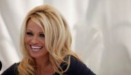 FILE PHOTO: Actress Pamela Anderson answers a question at a news conference to announce the launch of the online social platform FrogAds.com, in West Hollywood, California. Reuters/Mario Anzuoni/File Photo