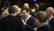Greek Prime Minister Alexis Tsipras talks with Luxembourg Prime minister Xavier Bettel during the European Union summit in Brussels on March 17, 2016 (AFP / JOHN THYS)