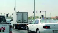 A freezer truck seen towing a car on the busy E-Ring Road.  Pic: Salim Matramkot / The Peninsula