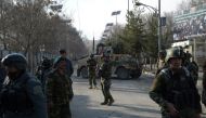 File photo of Afghan security personnel in front of the main gate of a military hospital in Kabul on March 8, 2017, after the deadly attack. AFP