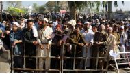 PESHAWAR, PAKISTAN, APRIL 03: Afghan refugees wait in a queue near the UNHCR office for their registration process to cross the Torkham Border Crossing for returning back to Afghanistan after reopening of the Pakistan-Afghanistan border, in Peshawar, Paki