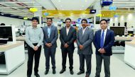 Officials of Sharaf DG, Ganesh Mithra P (second right), Country Head, Qatar and Bahrain; Suresh Babu (right), Store Manager at Ezdan Mall; Mohan Kumar (second left), Store-in-Charge at Doha Festival City (DFC), with other officials after a soft opening of