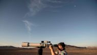 French astronomer Christian Nitschelm observes the sky with his telescope in Yungay, Atacama desert, some 80 kilometres south of Antofagasta, Chile on March 7, 2017. AFP / Martin Bernetti 