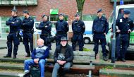 German riot police stand guard during the anti-immigration party Alternative for Germany (AfD) election campaign launch for the upcoming North Rhine-Westphalian federal state elections in Essen, Germany, yesterday.
