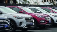 Brand new Hyundai Santa Fe SUVs are displayed at a Hyundai dealership on April 7, 2017 in Colma, California. South Korean automakers Kia and Hyundai announced that they are recalling 1.4 million cars and SUVs in the U.S., Canada and South Korea for a pote