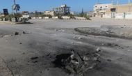A crater is seen at the site of an airstrike, after what rescue workers described as a suspected gas attack in the town of Khan Sheikhoun in rebel-held Idlib, Syria April 4, 2017. REUTERS/Ammar Abdullah.
