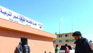 African migrants, whose boat sank off the Libyan coast, gather upon after their rescue at the Tripoli branch of the Anti-Illegal Immigration Authority, in the Libyan capital, yesterday.