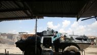 An Iraqi forces armoured personnel carrier (APC) is seen parked in a street in the old city of Mosul on April 15, 2017, during an offensive to recapture the city from Islamic State (IS) group fighters. / AFP / AHMAD AL-RUBAYE
