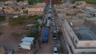 Buses carry Syrian civilians and opponent forces members, evacuated from Al-Waer district of Homs, Syria on April 19, 2017. ( Jawad Al Rifai - Anadolu Agency ).