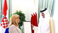 Emir H H Sheikh Tamim bin Hamad Al Thani receiving the Grand Order of King Tomislav with Sash and Great Star, the highest state order of the Republic of Croatia, from President Kolinda Grabar-Kitarovic, at Emiri Diwan yesterday.