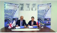 Ahmed Janahi, Gulf Air Chief Commercial Officer (left), and  Mariam Kvrivishvili, General Director at Voyager Ltd, at the signing ceremony.