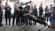 A Boston Dynamics Spot robot mingles with the crowd at the TED Conference in Vancouver, Canada, on April 25, 2017. AFP / Glenn CHAPMAN