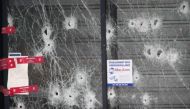 Bullet impacts are seen on the glass store front at the Hyper Cacher kosher supermarket January 12, 2015 near the Porte de Vincennes in Paris, where four hostages were killed. REUTERS/Charles Platiau.
