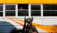 An Afghan security force member stands guard outside a military hospital at the site of blast and gunfire in Kabul, Afghanistan March 8, 2017. Reuters/Mohammad Ismail 