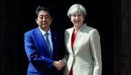 Britain's Prime Minister Theresa May (right) greets Japan's Prime Minister Shinzo Abe during a visit to Chequers, near Wendover, Britain