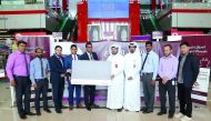 Qatar Charity and Quality Group International officials launching the card at Quality Mall in Al Hilal.