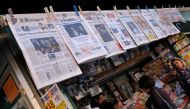 A picture shows front pages of Italian newspapers reporting on results of France's presidential election on May 8, 2017 in Rome. / AFP.