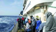 People are seen on board of ship Golfo Azurro during their way to Italy after they were rescued in the Mediterranean Sea in Italy.