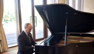 Russian President Vladimir Putin plays piano before meeting Chinese leader Xi Jinping on the first day of the Belt and Road Forum in Beijing, China May 14, 2017. Sputnik/Aleksey Nikolskyi/Kremlin via REUTERS 