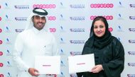 Sheikh Nasser bin Hamad bin Nasser Al Thani, Chief New Business Officer, Ooredoo Qatar, and Dr Sheikha Aisha bint Faleh Al Thani, Chairperson of Al Faleh Group for Educational and Academic Services, after signing the agreement.