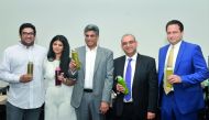 Chief Executive Officer of AlMana Group, Srinivas Vemparala (Centre), and other officials at the launch of Juicin’ It at Palm city Gardens. (Pic: Kammutty VP/ The Peninsula)