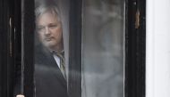 ASSANGE. This file photo taken on February 05, 2016 shows WikiLeaks founder Julian Assange coming out on the balcony of the Ecuadorian embassy to address the media in central London. File photo by Ben Stansall/ AFP.