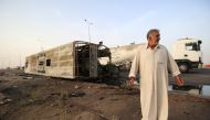 A damaged car is seen after an attack staged twin bombs rocked in Basra, Iraq on May 20, 2017. Haider el-Esadi - AA