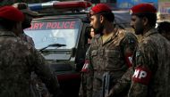 FILE PHOTO: Pakistan Army soldiers stand beside a jeep after it was attacked by gunmen along a road in Karachi, December 1, 2015 (Reuters)