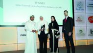 From Left:  Eisa Ahmed Abdulla, COO and Managing Director, Corporate Services; Najat El Mahdy, Head of Organisational Development; and Wadha Al Jaber, Associate, Human Resources, all from the QFC Regulatory Authority, receiving the “Best Nationalisation I