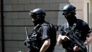 Armed police officers stand outside a residential property near to where a man was arrested in the Chorlton area of Manchester, Britain May 23, 2017. REUTERS/Stefan Wermuth
