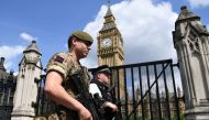 British Army soldiers patrol along Whitehall near Downing Street and the Houses of Parliament in central London on May 24, 2017. AFP / Justin TALLIS
