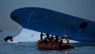 Maritime police search for missing passengers in front of the South Korean ferry ''Sewol'' which sank at the sea off Jindo April 16, 2014. Kim Hong-Ji, Reuters/File Photo.